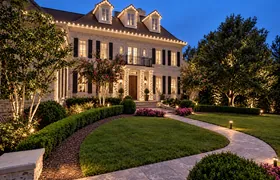 Design rendering: Curved walkway leading to an estate with Christmas roofline lights