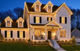 Design rendering: White home with Christmas lights tracing the porch and upper gables