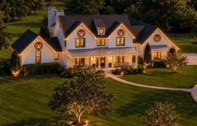 Design rendering: Aerial view of a home with Christmas wreaths and roofline lights